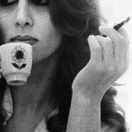 Fairouz drinking coffee